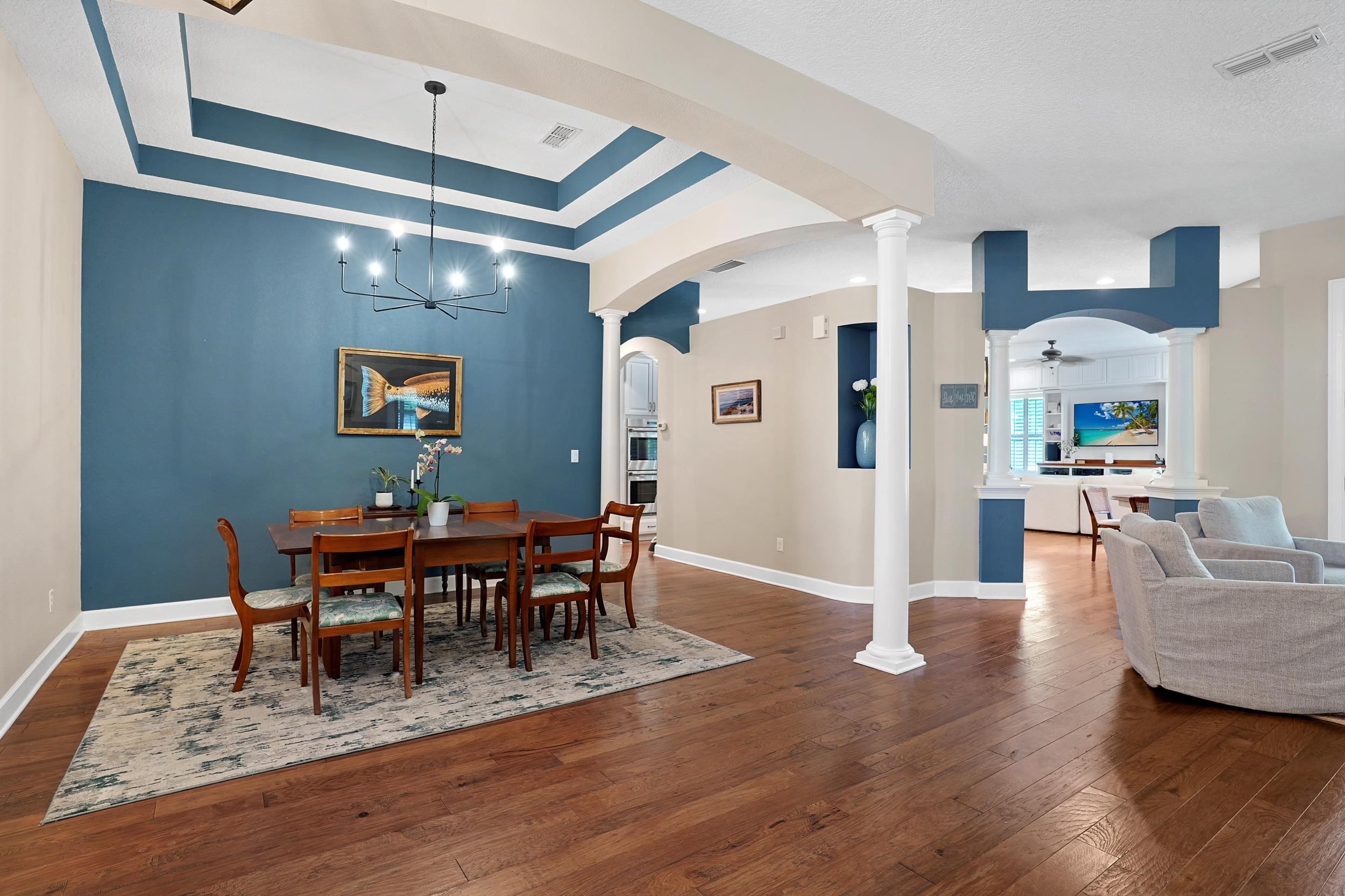 1308 Acorn Ridge Court St. Augustine, FL 32092 - Photo 5 of 47 a view of a dining room with furniture and wooden floor