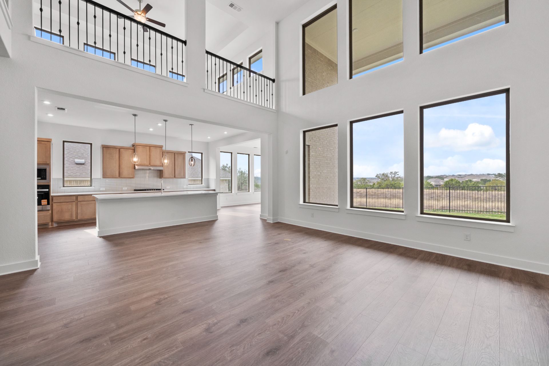 1802 Crimson Sunset Drive Georgetown, TX 78628 - Photo 15 of 38 From Family Room to Open Concept Kitchen