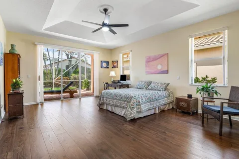 a bedroom with a large bed and a large window