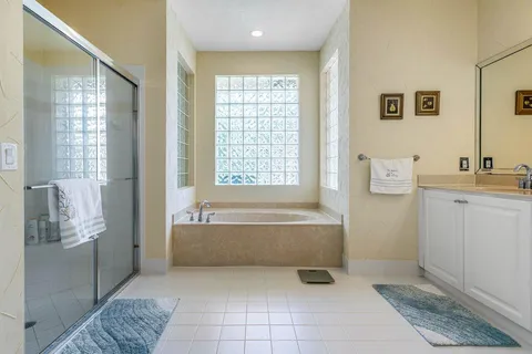 a bathroom with a bathtub and shower
