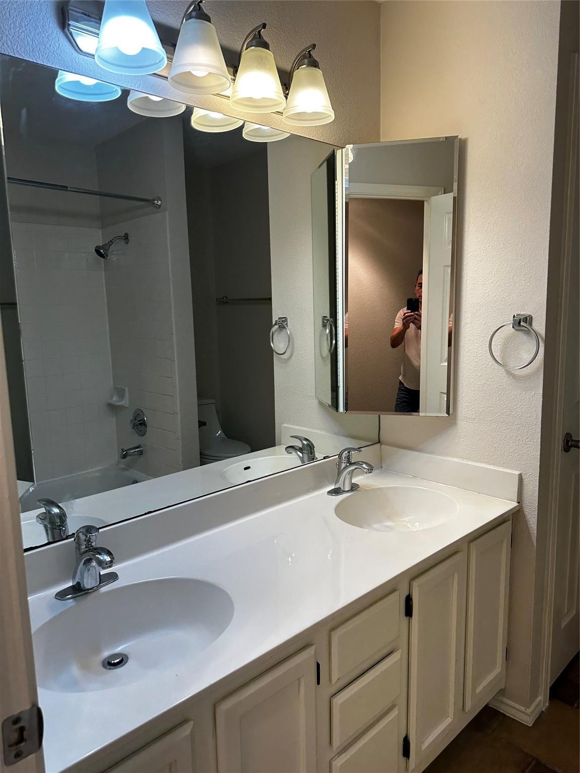 8007 Bounty Trail Austin, TX 78749 - Photo 27 of 32 Double vanity with ample counter space and well-lit mirror.
