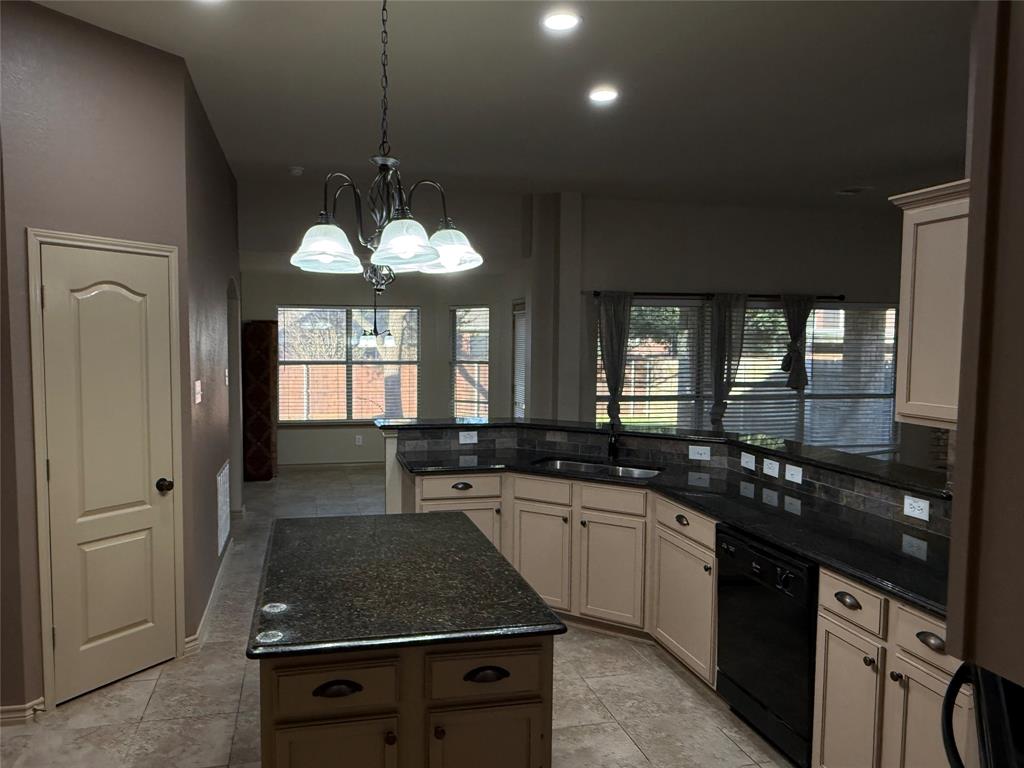 3624 Big Horn Trail Denton, TX 76210 - Photo 8 of 10 a kitchen with stainless steel appliances a sink stove and cabinets