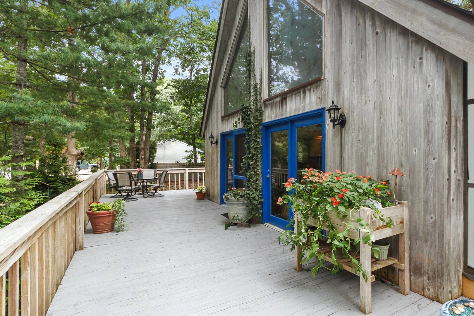 62 Broadway East Hampton, NY 11937 - Photo 18 of 20 a view of a chair and table in the balcony