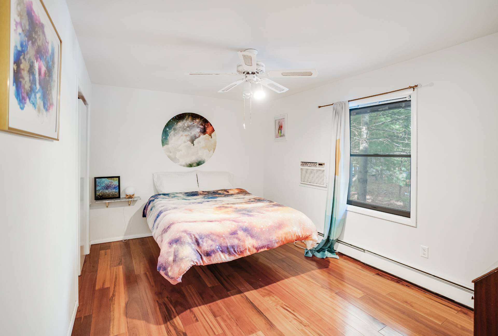62 Broadway East Hampton, NY 11937 - Photo 10 of 20 a bedroom with a bed and a window
