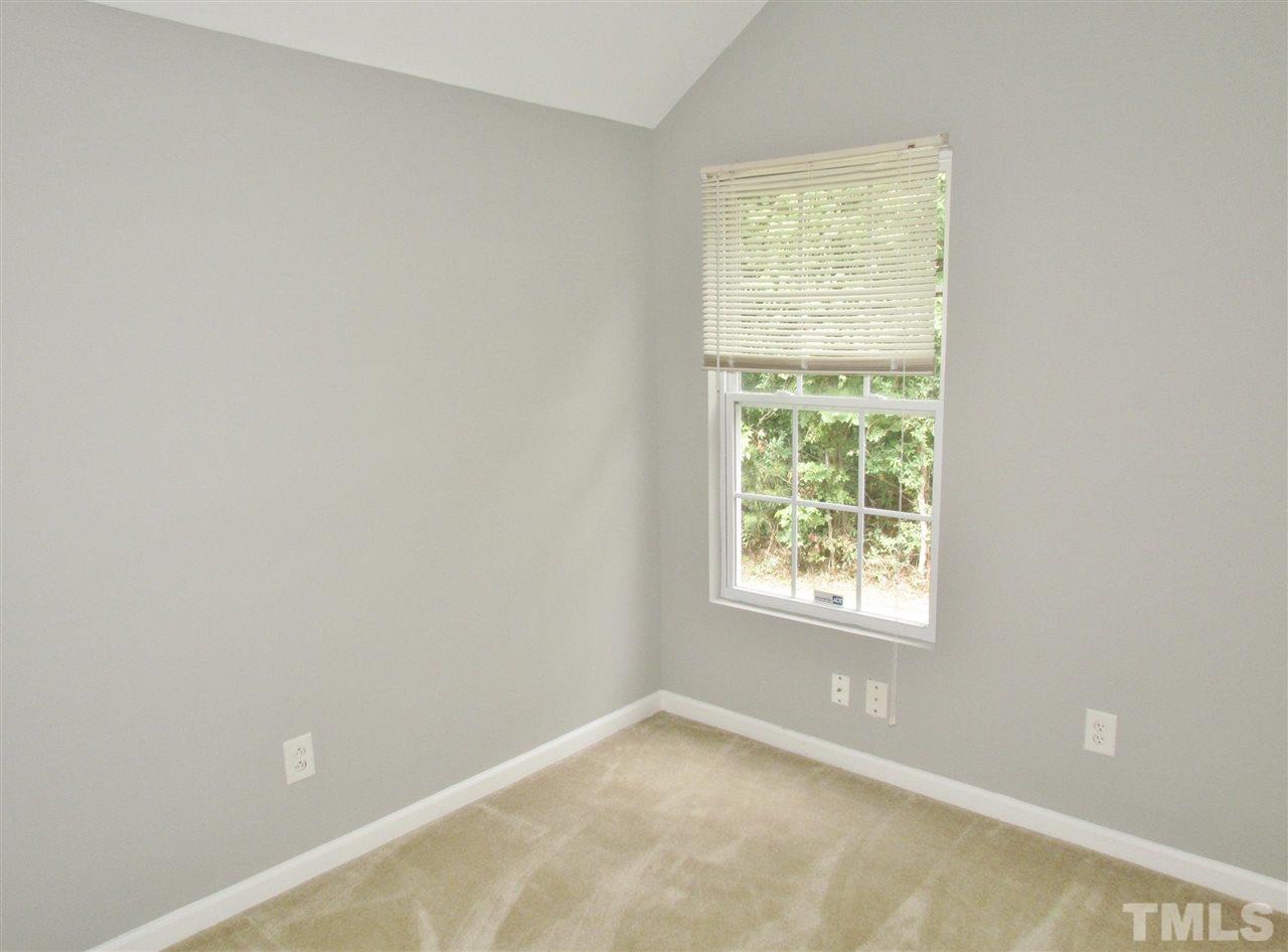 905 Roxy Street Raleigh, NC 27610 - Photo 22 of 30 a view of an empty room with a window