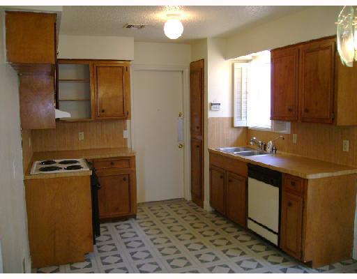 9503 Quetzal Street Corpus Christi, TX 78418 - Photo 3 of 5 a kitchen with a refrigerator stove and sink