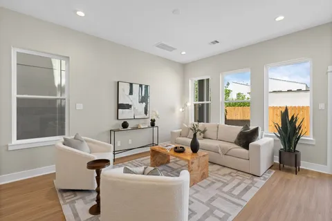 a living room with furniture and a table