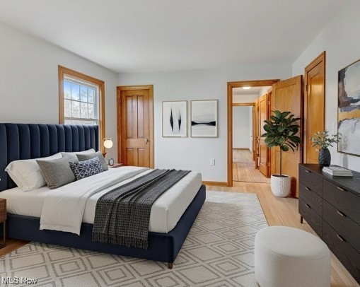 43800 Middle Ridge Road Lorain, OH 44053 - Photo 15 of 31 Virtually staged - Bedroom featuring light wood-style floors and baseboards