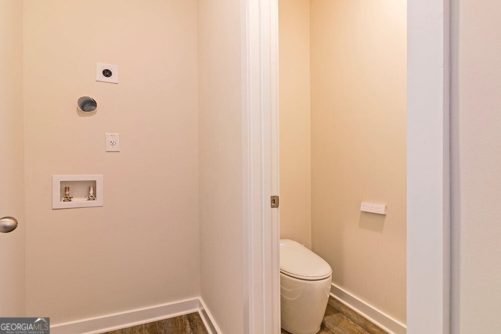 148 Post Oak Drive, Unit 139 Jackson, GA 30233 - Photo 17 of 24 a white toilet sitting next to a shower