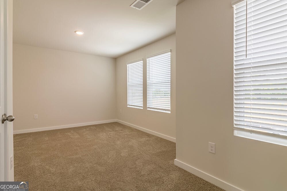 148 Post Oak Drive, Unit 139 Jackson, GA 30233 - Photo 18 of 24 an empty room with windows