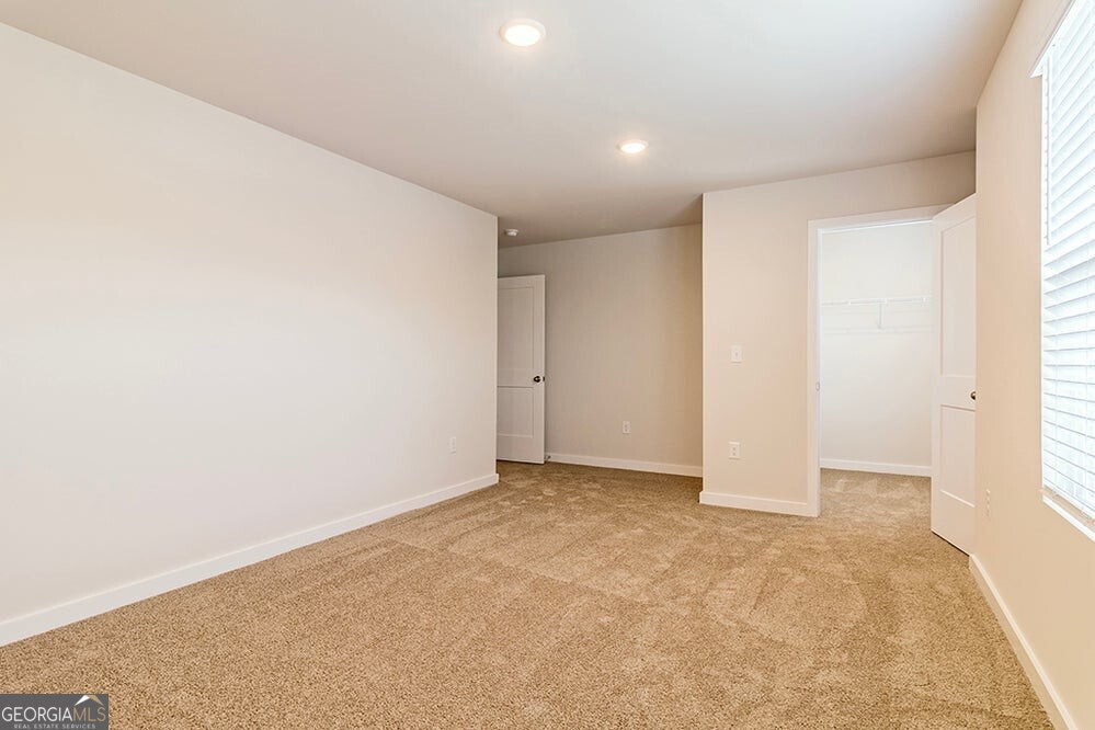 148 Post Oak Drive, Unit 139 Jackson, GA 30233 - Photo 19 of 24 an empty room with windows