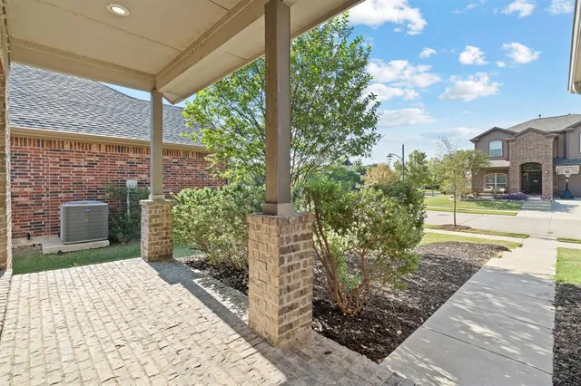 a dining room with furniture and chandelier