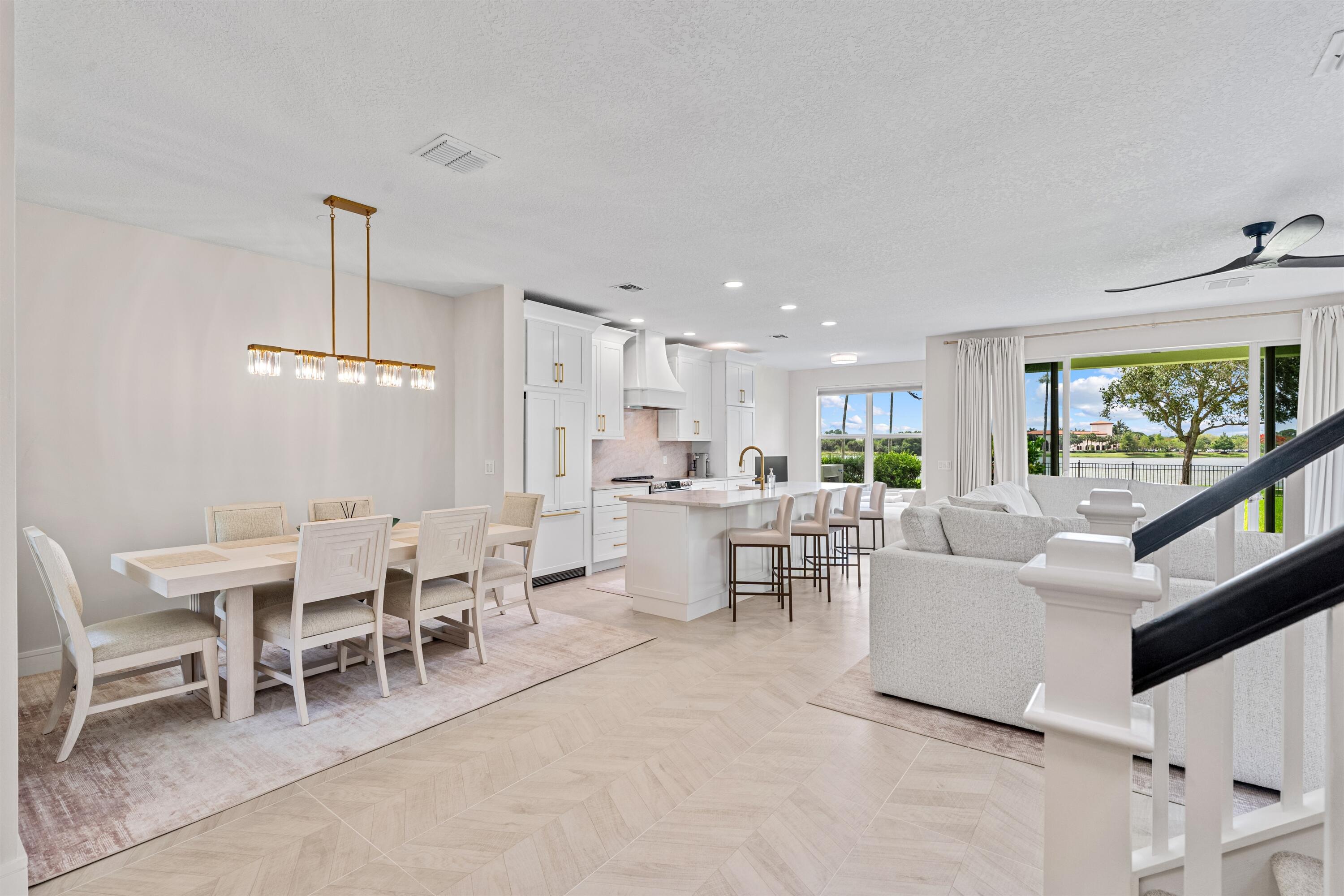 1570 Northwest 48th Place Boca Raton, FL 33431 - Photo 3 of 30 a living room with furniture a window and kitchen view