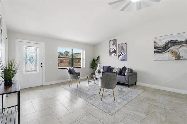 a living room with furniture and window