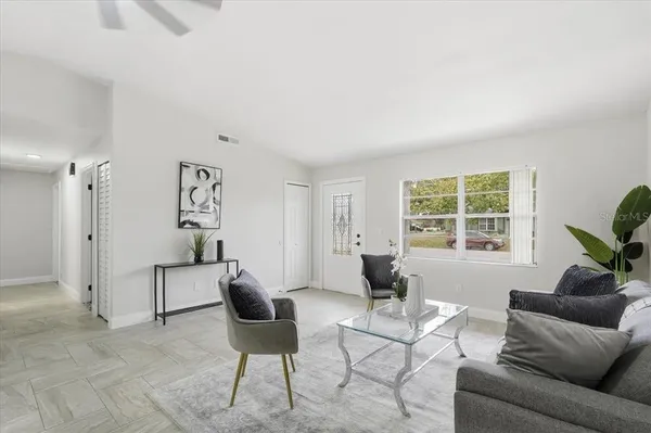 a living room with furniture and a window