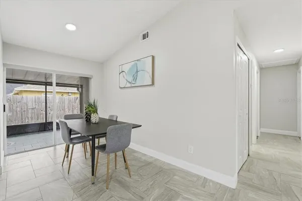a view of a livingroom with furniture and window