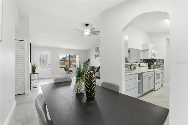 a view of kitchen with furniture and wooden floor