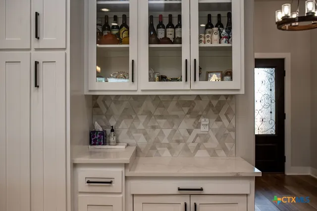 a view of a workspace with furniture and wooden floor