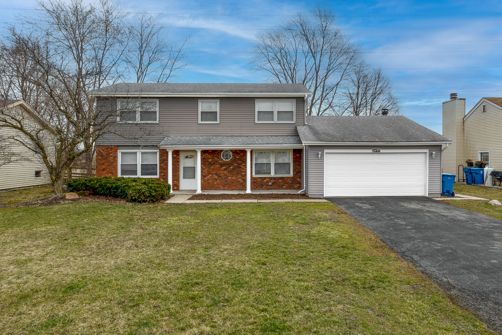 3497 Ronald Road Crete, IL 60417 - Photo 1 of 17 a front view of a house with a yard and garage