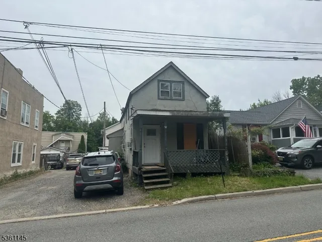 a car parked in front of a house