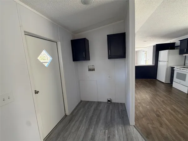 a view of a livingroom with wooden floor