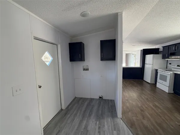 a view of a livingroom with furniture and wooden floor