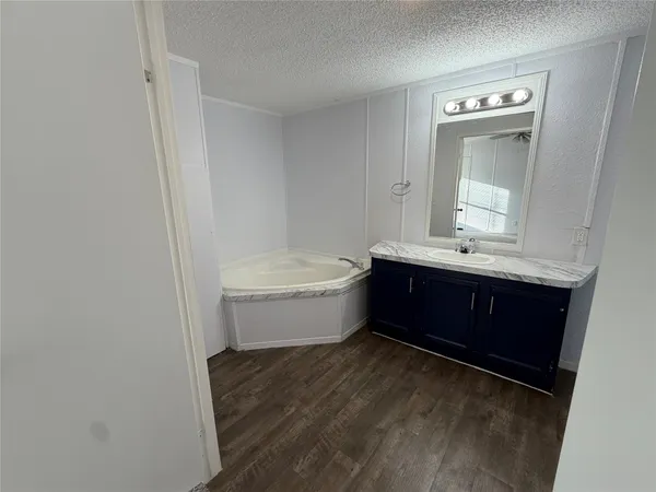 a view of a livingroom with a ceiling fan and window