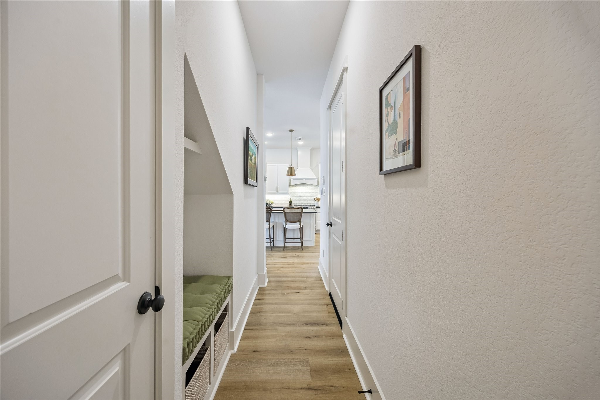 2512 Swang Pl. Houston, TX 77008 - Photo 18 of 46 The hallway leading to the garage and powder room features a built-in bench with hooks and storage.