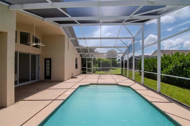a view of swimming pool with an outdoor seating