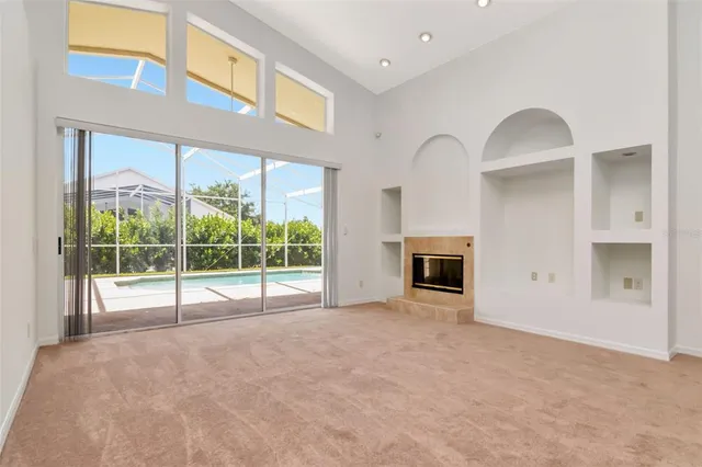 a view of empty room with floor to ceiling window