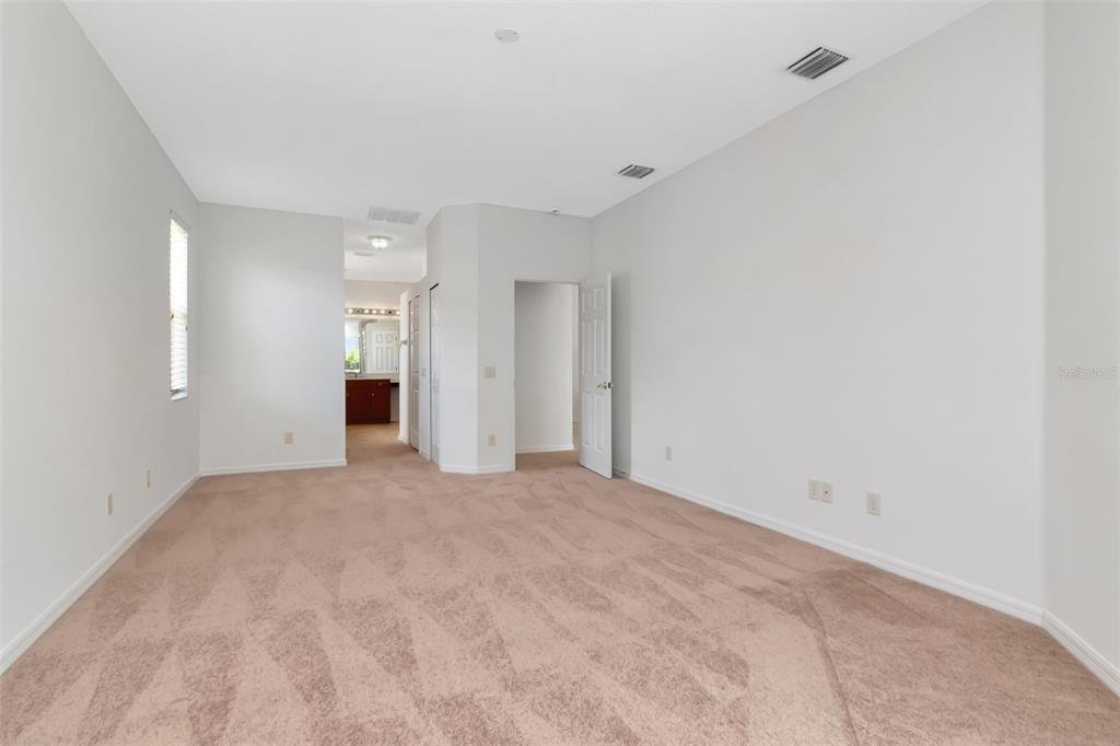 1927 Alecost Court Trinity, FL 34655 - Photo 17 of 44 a view of an empty room with a kitchen