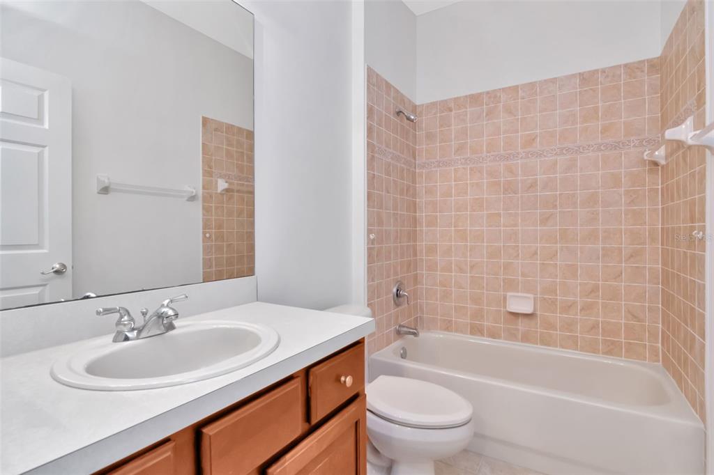 1927 Alecost Court Trinity, FL 34655 - Photo 29 of 44 a bathroom with a sink a toilet and shower