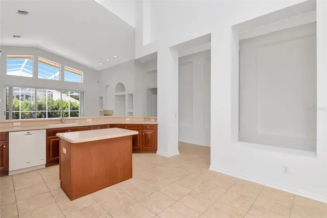 a kitchen with stainless steel appliances granite countertop a sink and a stove