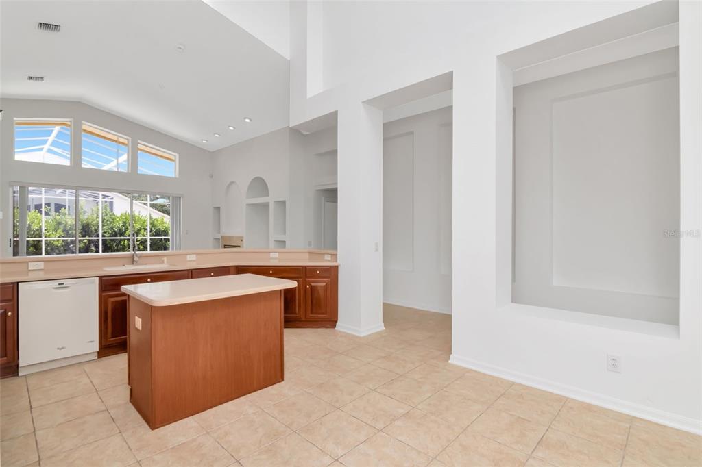 1927 Alecost Court Trinity, FL 34655 - Photo 35 of 44 a kitchen with stainless steel appliances granite countertop a sink and a stove