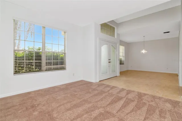 a view of an empty room with a window