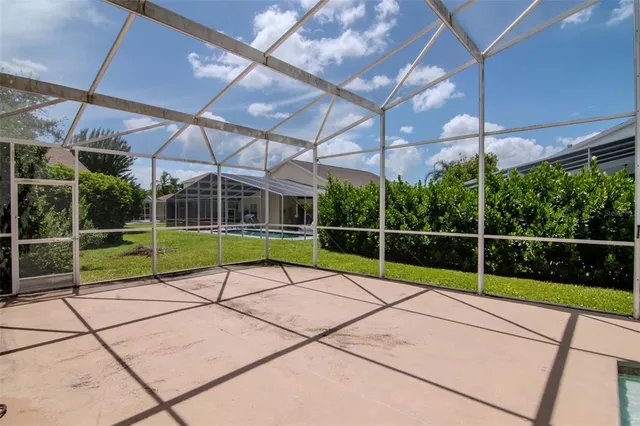 a view of a backyard with a swimming pool