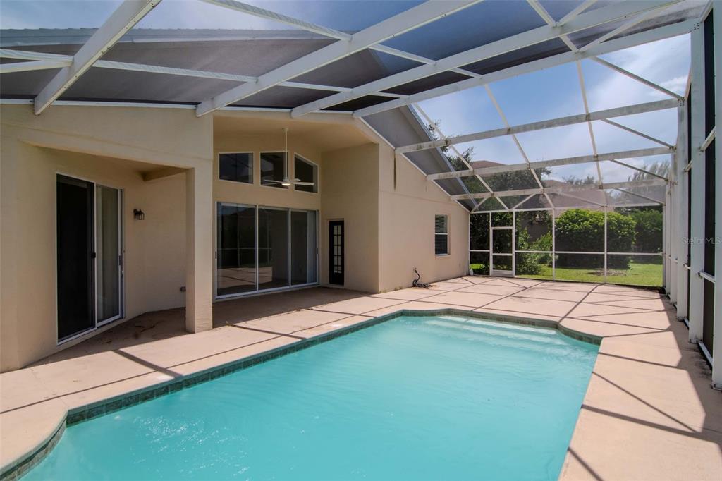 1927 Alecost Court Trinity, FL 34655 - Photo 10 of 44 a house with swimming pool in front of it