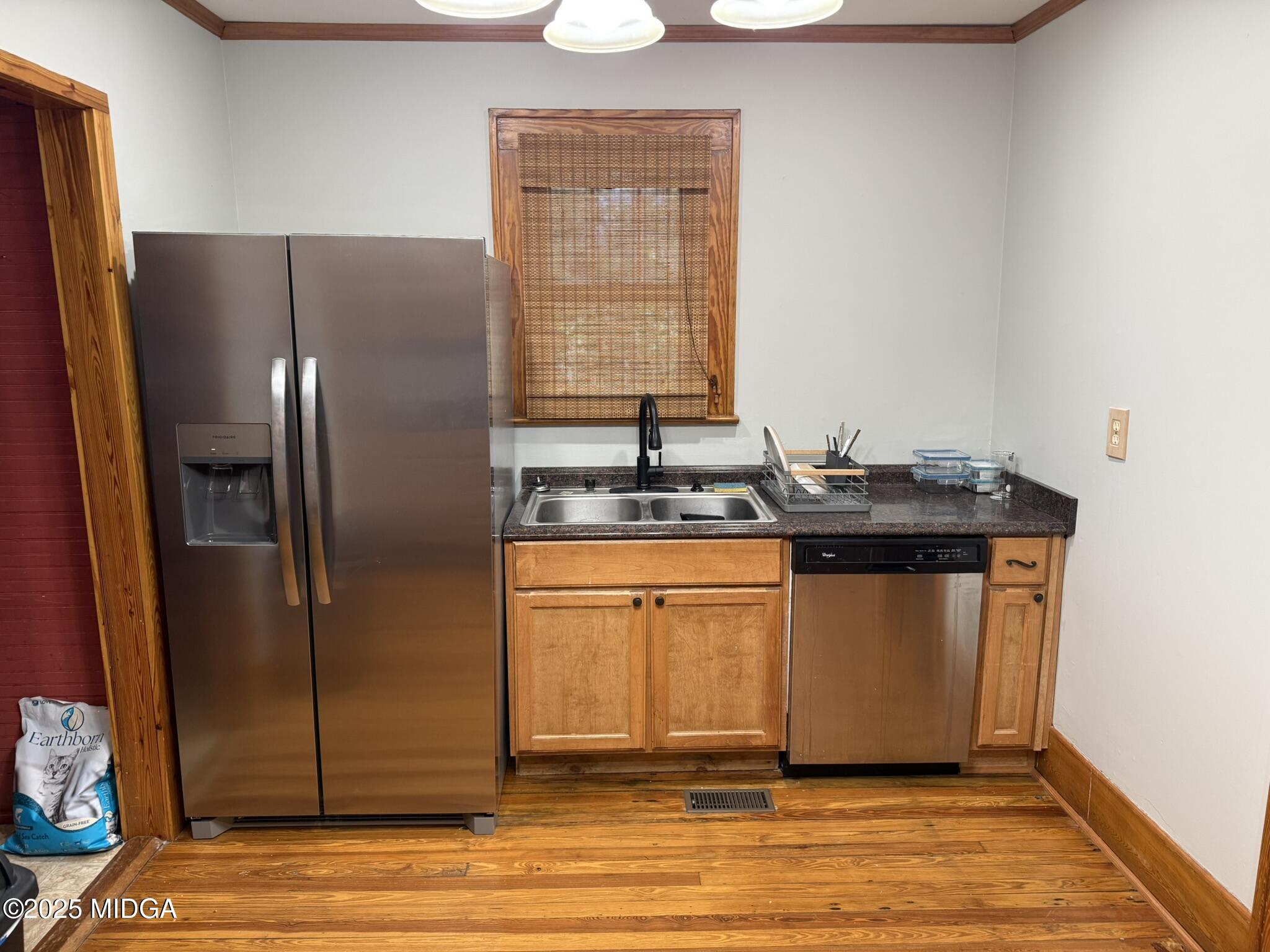 3020 Millerfield Road Macon, GA 31217 - Photo 11 of 20 a kitchen with stainless steel appliances granite countertop a refrigerator and a sink