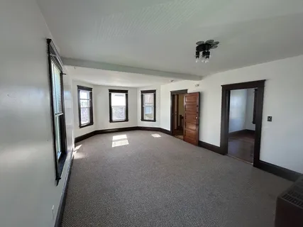 a view of empty room with windows