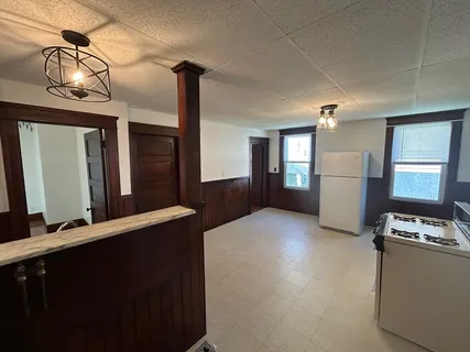 a bathroom with a toilet a sink and shower
