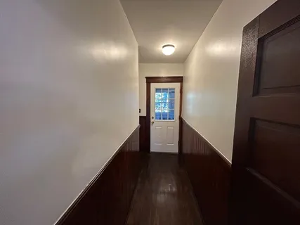 a view of a hallway with windows