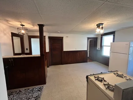 a kitchen with refrigerator and window