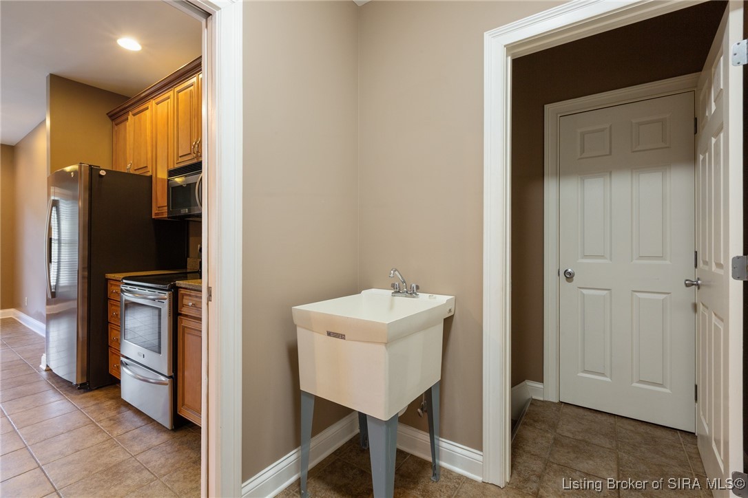 6201 Cherry Grove Court Georgetown, IN 47122 - Photo 25 of 87 Laundry/basement stairs and closet