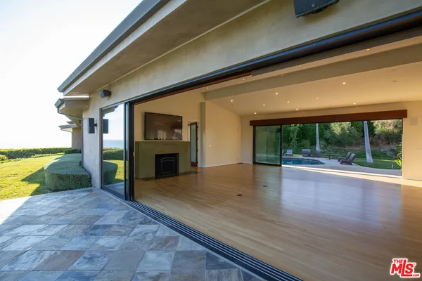 a view of a living room and a fireplace