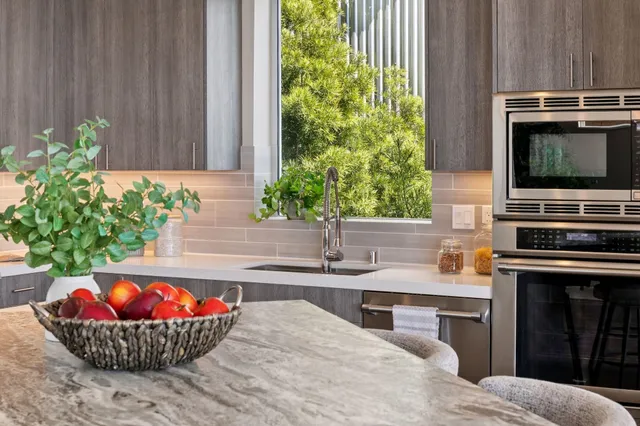a kitchen with a stove a sink and a refrigerator