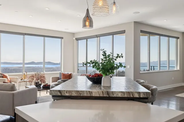 a view of a living room and a balcony