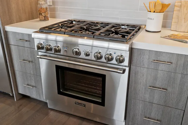 a bedroom with a bed and a lamp