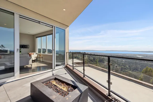 a bedroom with bed and a potted plant