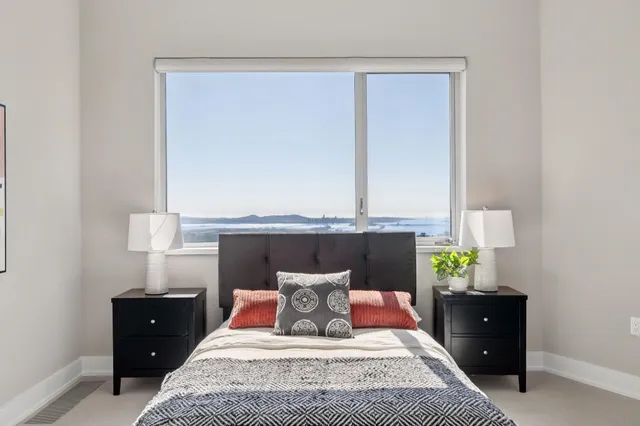 a bedroom with furniture and a window