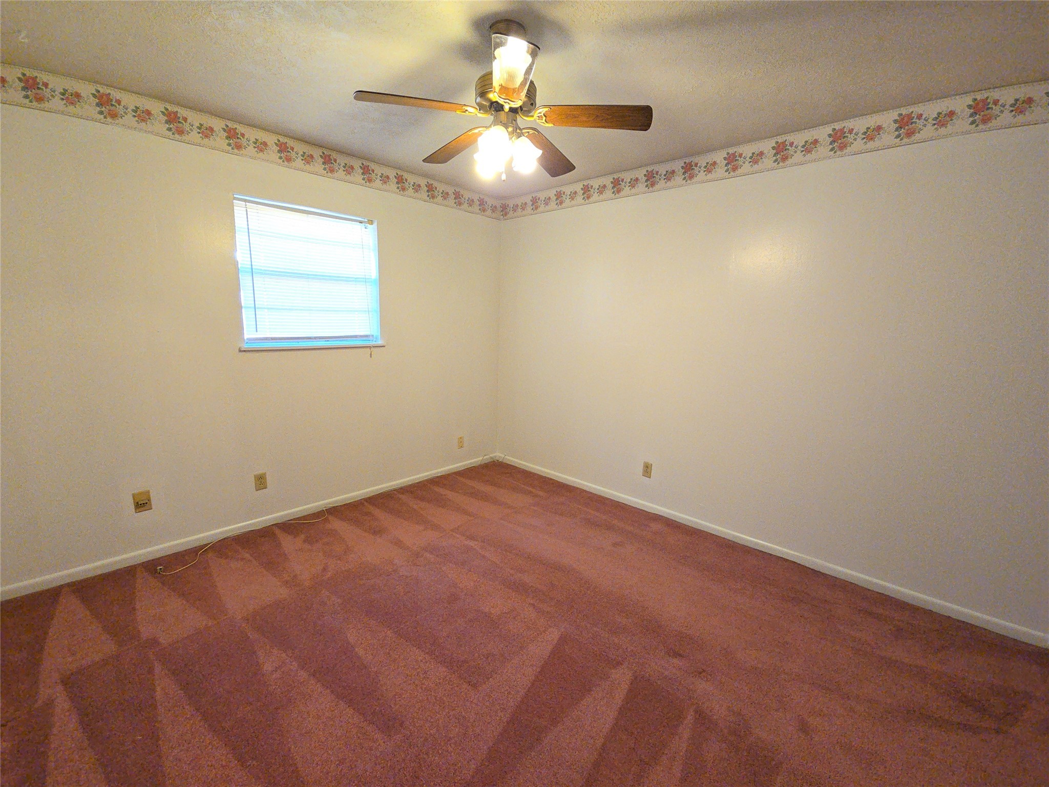 1206 Crescent Boulevard Cleveland, TX 77327 - Photo 14 of 33 a view of a room with a hanging light and hardwood